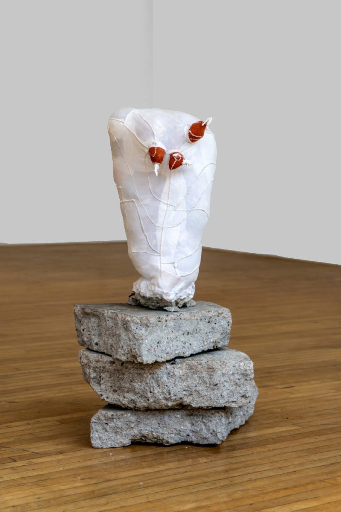 China Adams, Untitled, 2023, 10 freeway concrete, broken glass animals, artists’ scrap (material, clothing, rags), dental floss, 18.5 X 10.5 X 9 inches