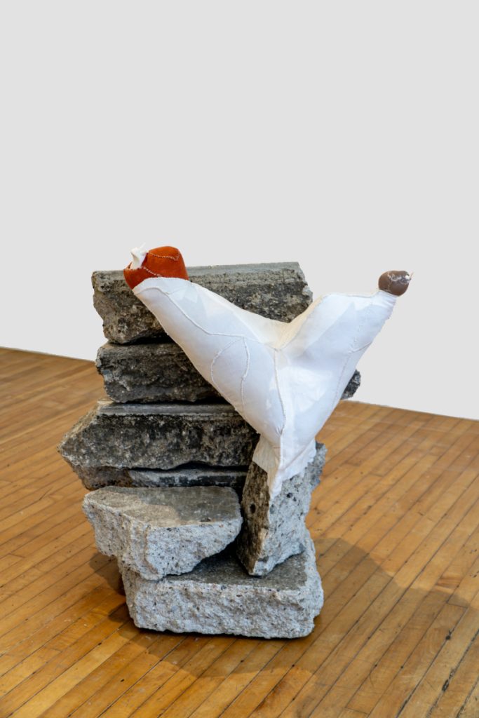 China Adams, Untitled, 2023, 10 freeway concrete, broken glass animals, artists’ scrap (material, clothing, rags), dental floss, 20.5 X 18.5 X 8 inches